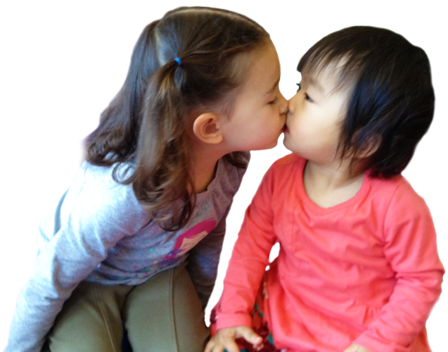 two young girls kissing